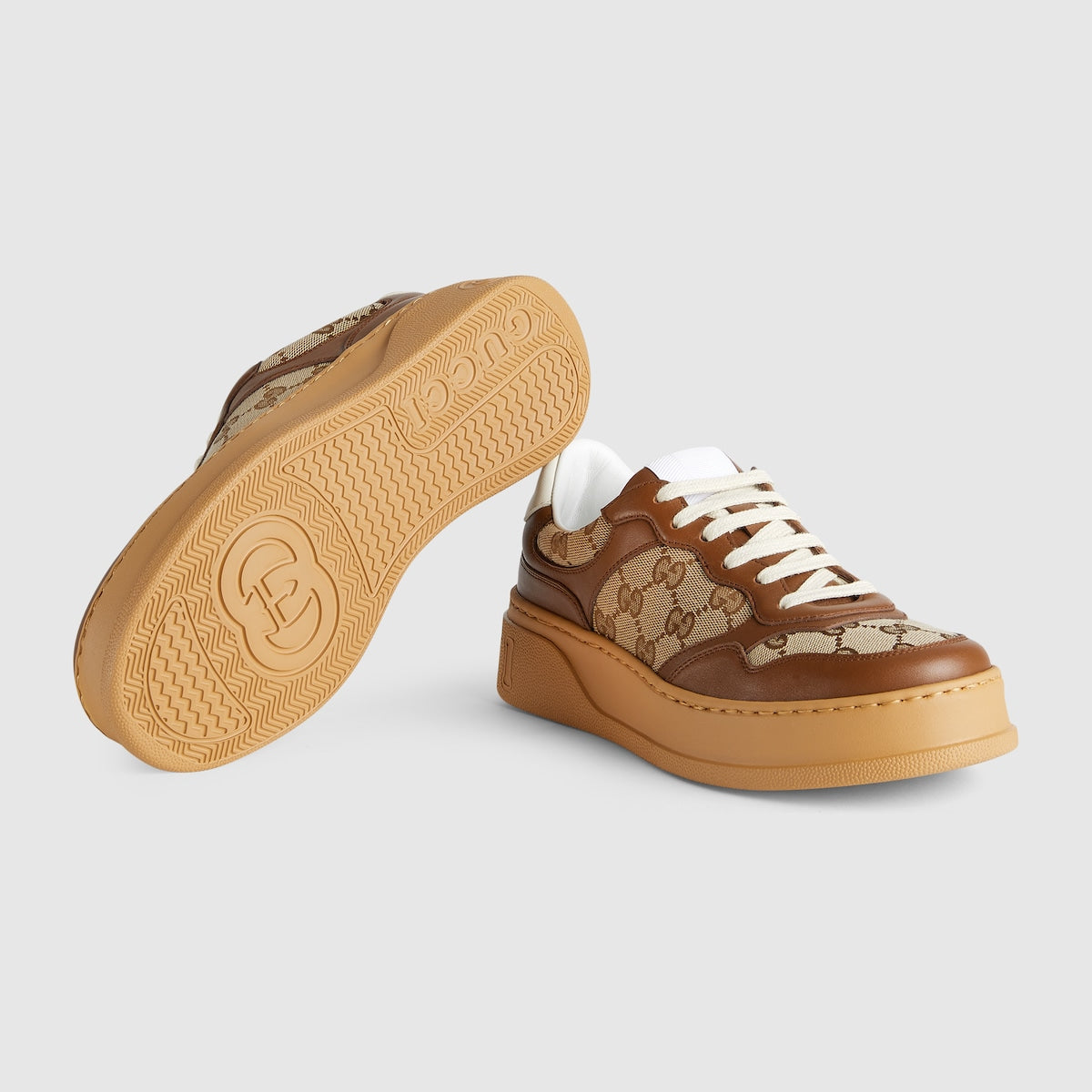 GG sneaker – with a defined rubber sole, the shoe is crafted from beige and ebony Original GG – LUX VERSE Luxury Designer Fashion Outlet