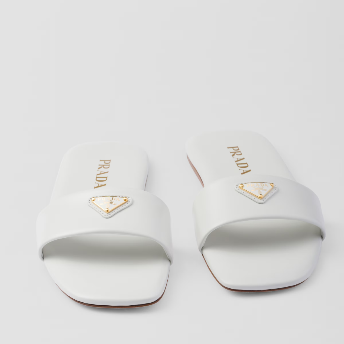 Leather slides – the flat, sleek leather silhouette with a square toe is completed by the iconic – LUX VERSE Luxury Designer Fashion Outlet