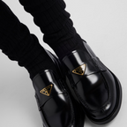 Brushed leather loafers – the style completed with a thin rubber sole is decorated with the iconic enameled – LUX VERSE Luxury Designer Fashion Outlet