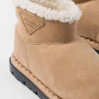 Shearling booties – embossed rubber triangle logo 10 cm boot leg 20 mm rubber sole Lug tread Leather – LUX VERSE Luxury Designer Fashion Outlet