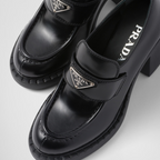 Chocolate brushed loafers – the style is decorated with the enameled metal triangle logo on the front – LUX VERSE Luxury Designer Fashion Outlet