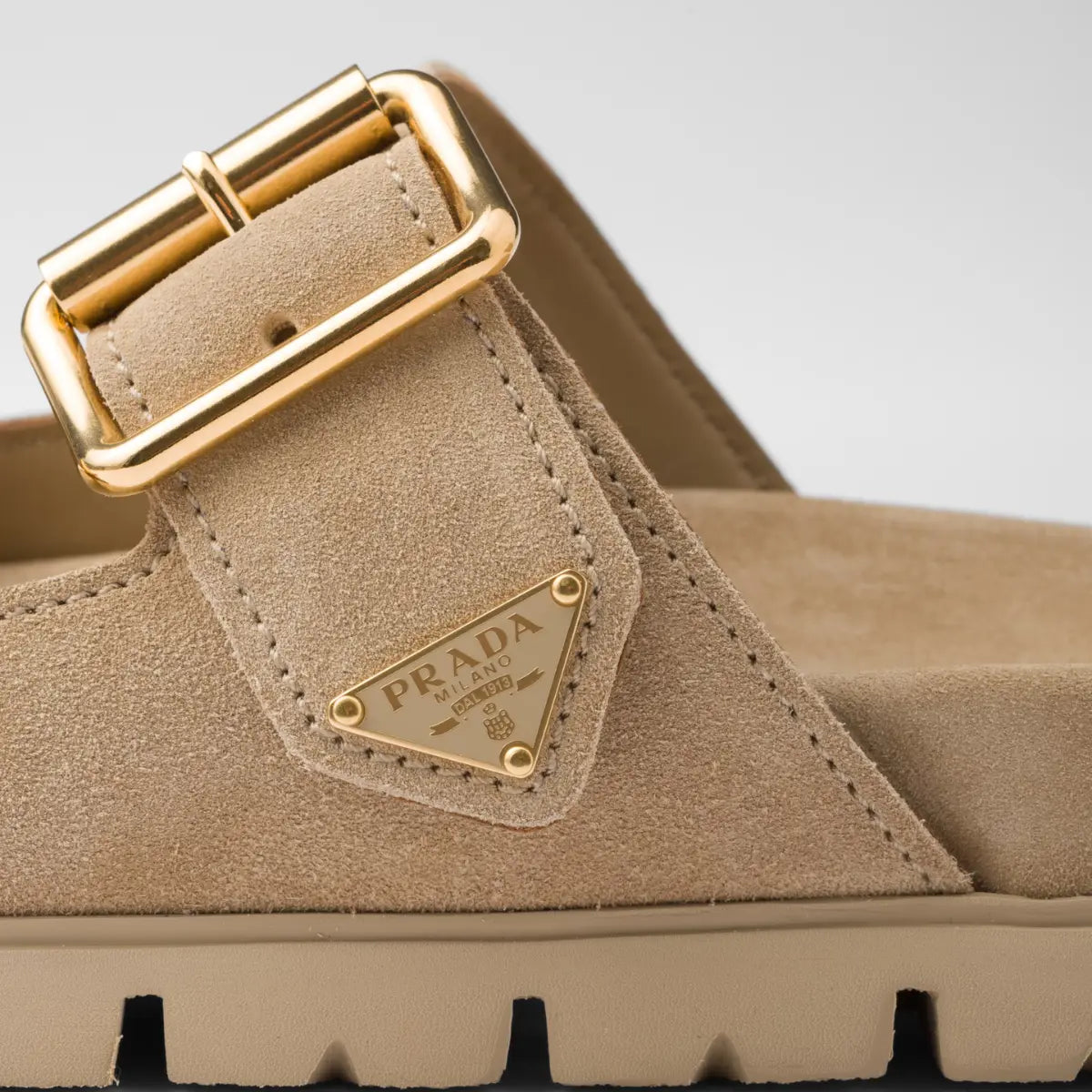 Suede strap slides – the enameled metal triangle logo embellishes the style with its sleek and iconic – LUX VERSE Luxury Designer Fashion Outlet