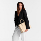 OnTheGo MM Creme – the roomy interior can easily fit a laptop while rolled-leather top handles and two – LUX VERSE Luxury Designer Fashion Outlet