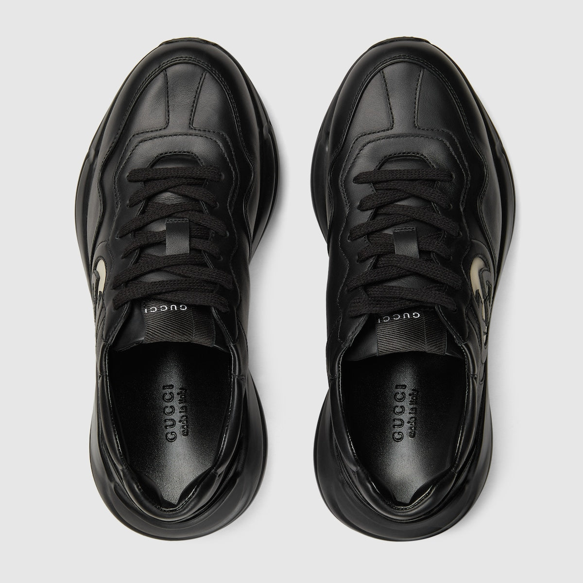 Women's leather Rhyton sneaker – this pair of black leather Rhyton sneakers is defined by a bold Interlocking G – LUX VERSE Luxury Designer Fashion Outlet