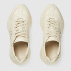 Rhyton sneaker – this pair of ivory leather Rhyton sneakers is defined by a bold Interlocking G – LUX VERSE Luxury Designer Fashion Outlet