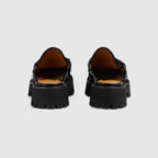 Mule with Horsebit – combining the stylistic elements of boots and moccasins, this black leather mule – LUX VERSE Luxury Designer Fashion Outlet