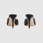 Mid-heel slide sandal – here, this pair of black leather slide sandals is defined by the Horsebit hardware – LUX VERSE Luxury Designer Fashion Outlet
