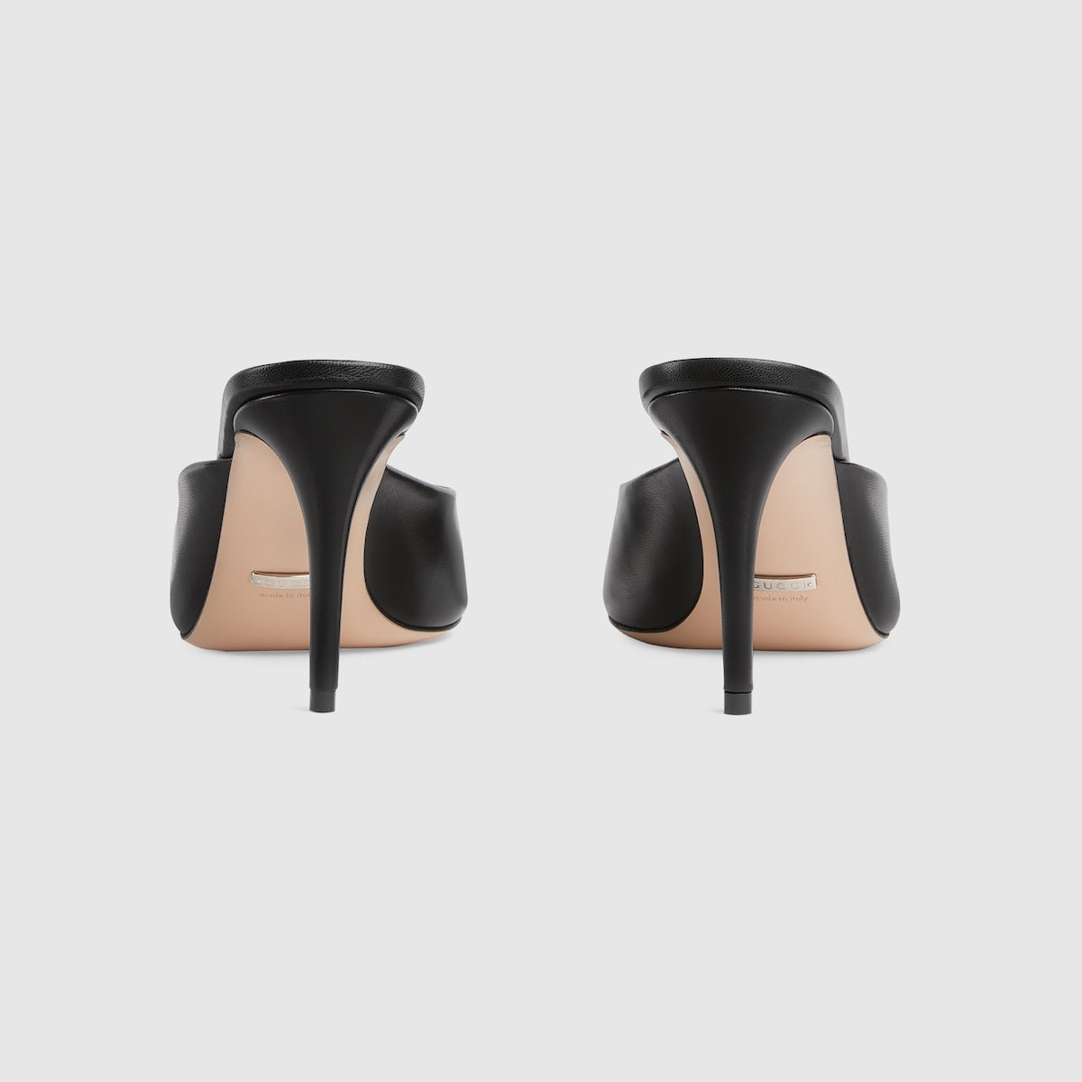 Mid-heel slide sandal – here, this pair of black leather slide sandals is defined by the Horsebit hardware – LUX VERSE Luxury Designer Fashion Outlet