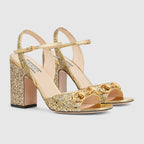 Women's mid-heel sandal with Horsebit – presented in an eye-catching metallic gold leather, this pair of sandals is – LUX VERSE Luxury Designer Fashion Outlet
