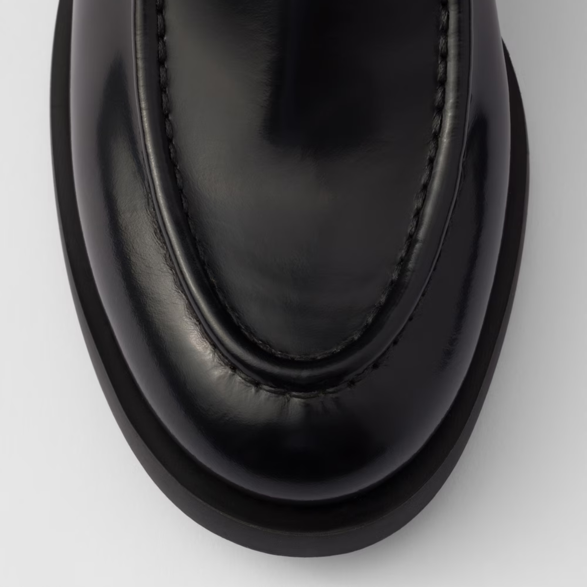 Brushed leather loafers Black – upper with leather band Enameled metal triangle logo Monoblock rubber sole – LUX VERSE Luxury Designer Fashion Outlet