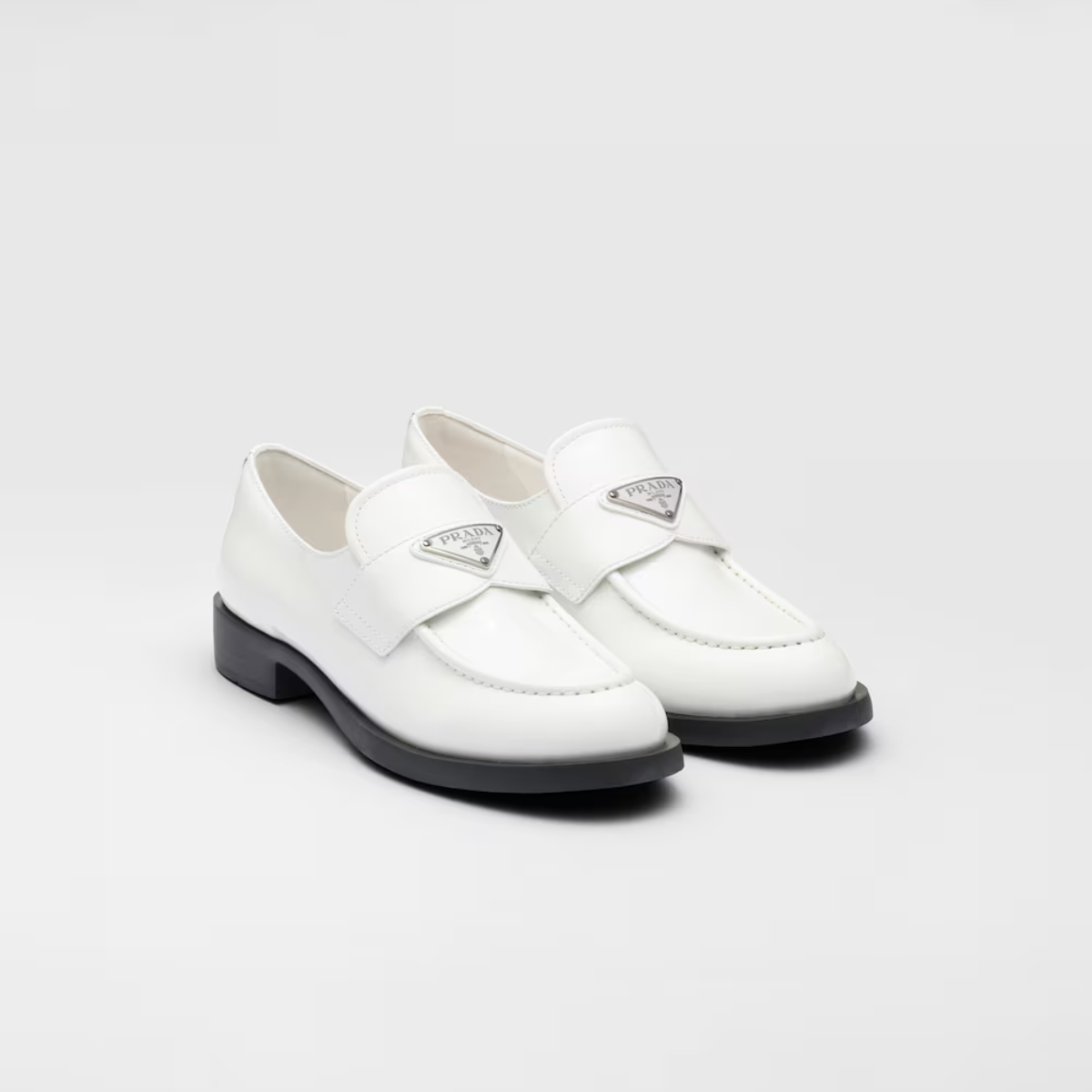Patent Glossy Finish leather loafers – upper with leather band Enameled metal triangle logo Rubber monoblock sole – LUX VERSE Luxury Designer Fashion Outlet