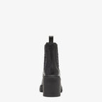 Domino – made of black leather and part of the collection curated with designer Stefano Pilati – LUX VERSE Luxury Designer Fashion Outlet