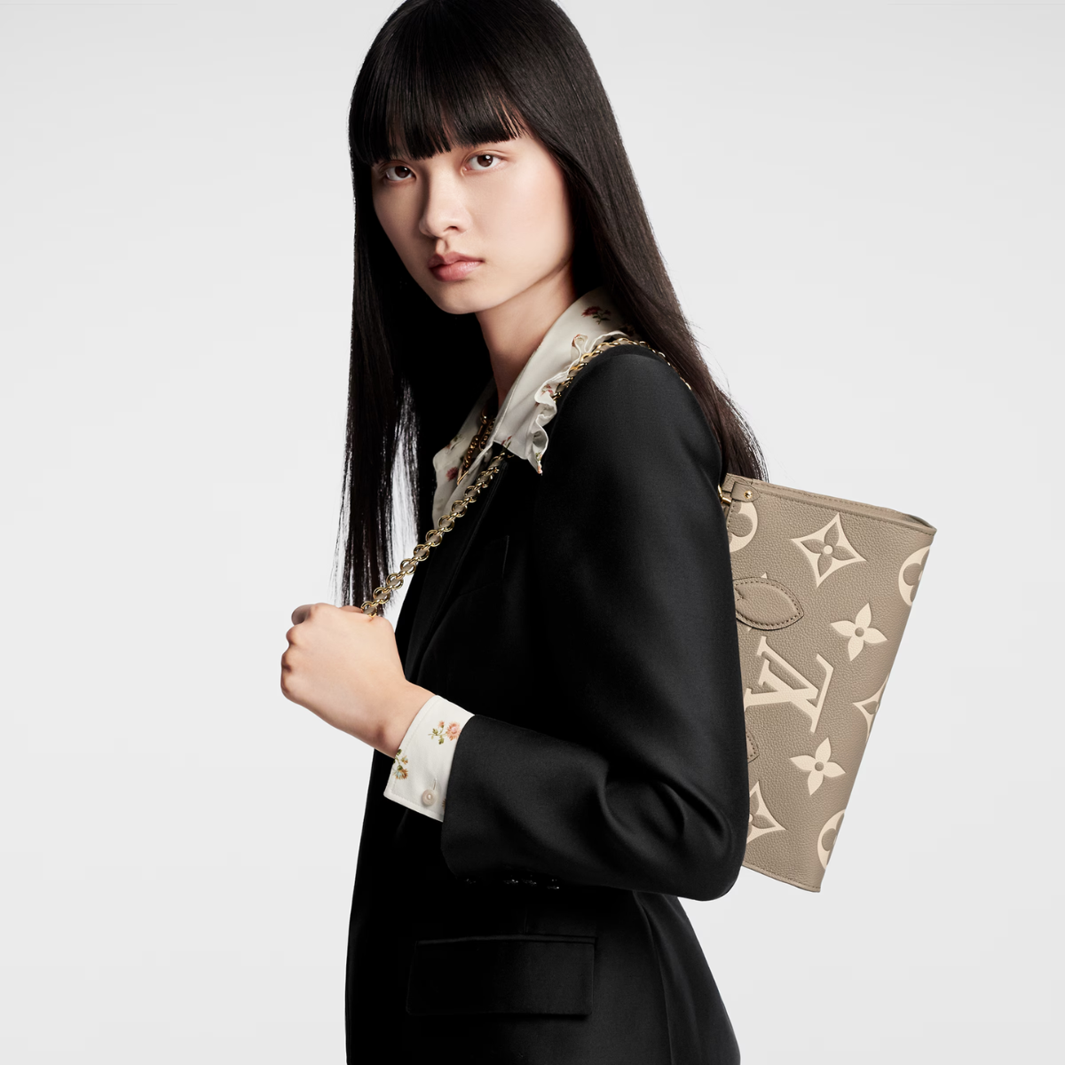 OnTheGo East West B – made from Monogram Empreinte leather embossed with a tonal Giant Monogram motif, – LUX VERSE Luxury Designer Fashion Outlet
