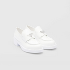 Chocolate patent leather loafers – the triangle logo, first introduced on trunks designed by Mario, decorates the front – LUX VERSE Luxury Designer Fashion Outlet