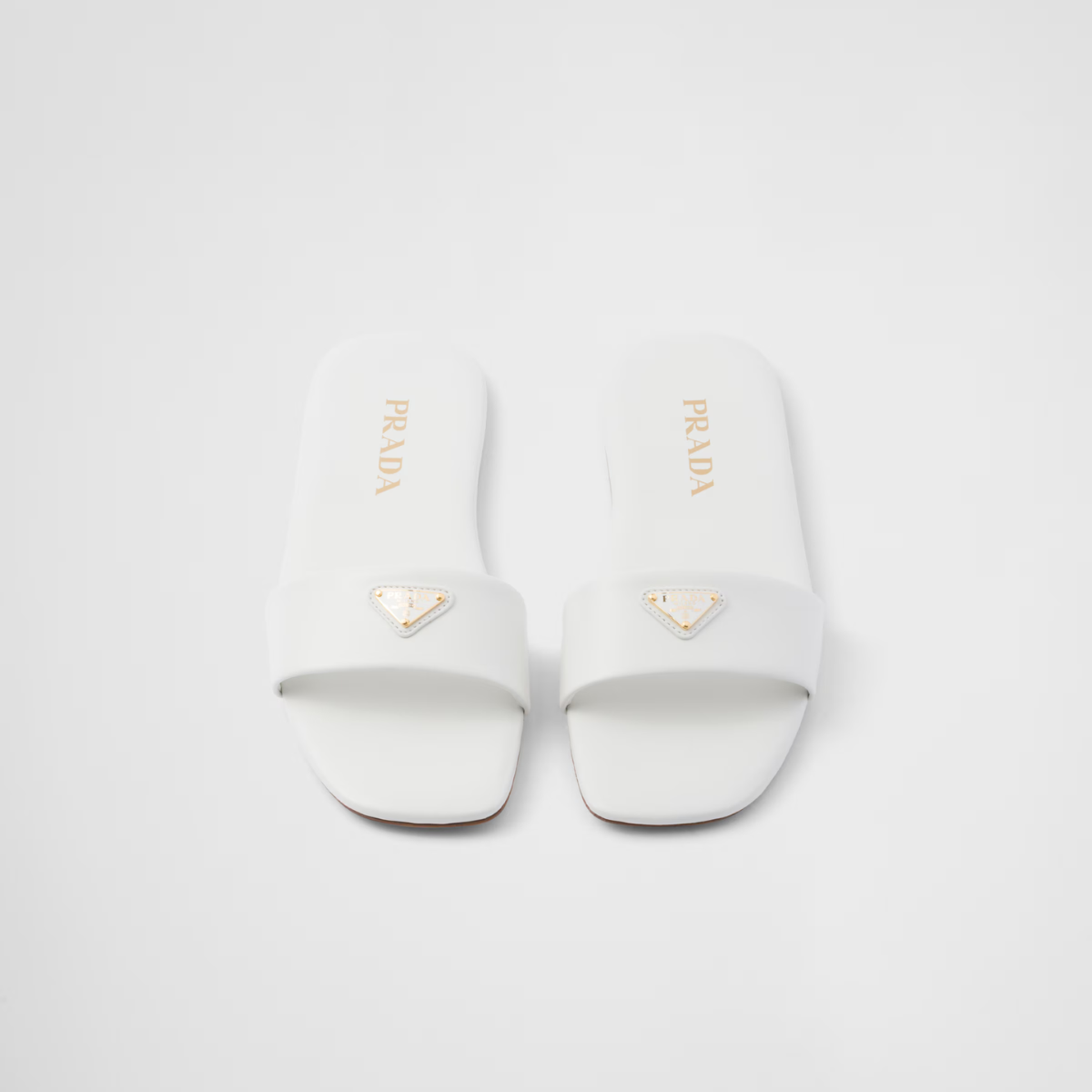 Leather slides – enameled metal triangle logo Monoblock leather sole, 5 mm, with hot-stamped logo – LUX VERSE Luxury Designer Fashion Outlet