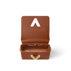 Twist PM Chic Style – the flap is secured with the iconic golden Twist lock, and the bag’s wide, – LUX VERSE Luxury Designer Fashion Outlet