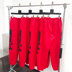 Rote Jogginghose mit seitlichem Print – Herren