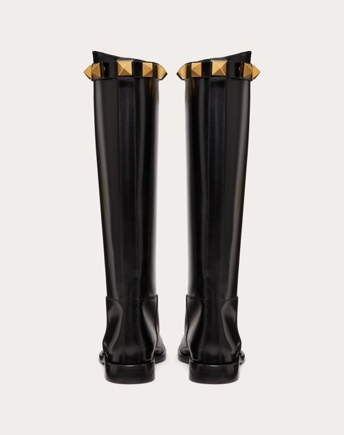 Calfskin Leather Roman Stud Boot 15mm – antique-effect finish- Detachable studded strap on the leg- Heel height – LUX VERSE Luxury Designer Fashion Outlet