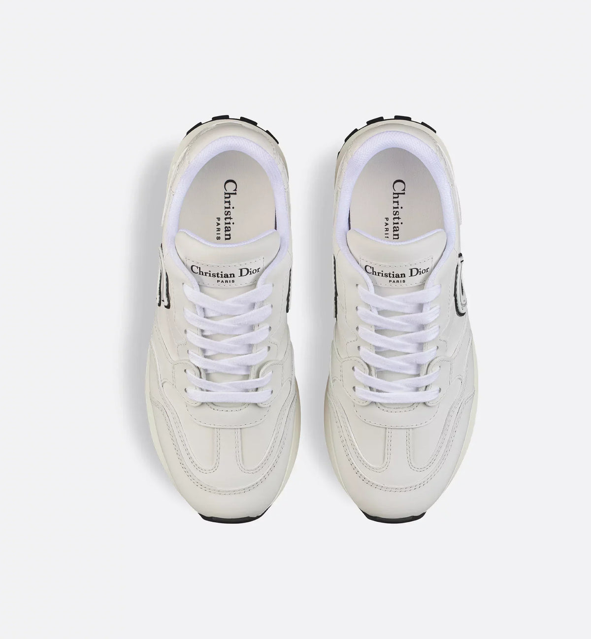 C'est Sneaker – the tongue and two-tone ultralightweight sole with signatures accentuate – LUX VERSE Luxury Designer Fashion Outlet