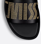 Dway Calfskin Slide – the black calfskin upper features a gold-finish studded Miss on one foot and on – LUX VERSE Luxury Designer Fashion Outlet