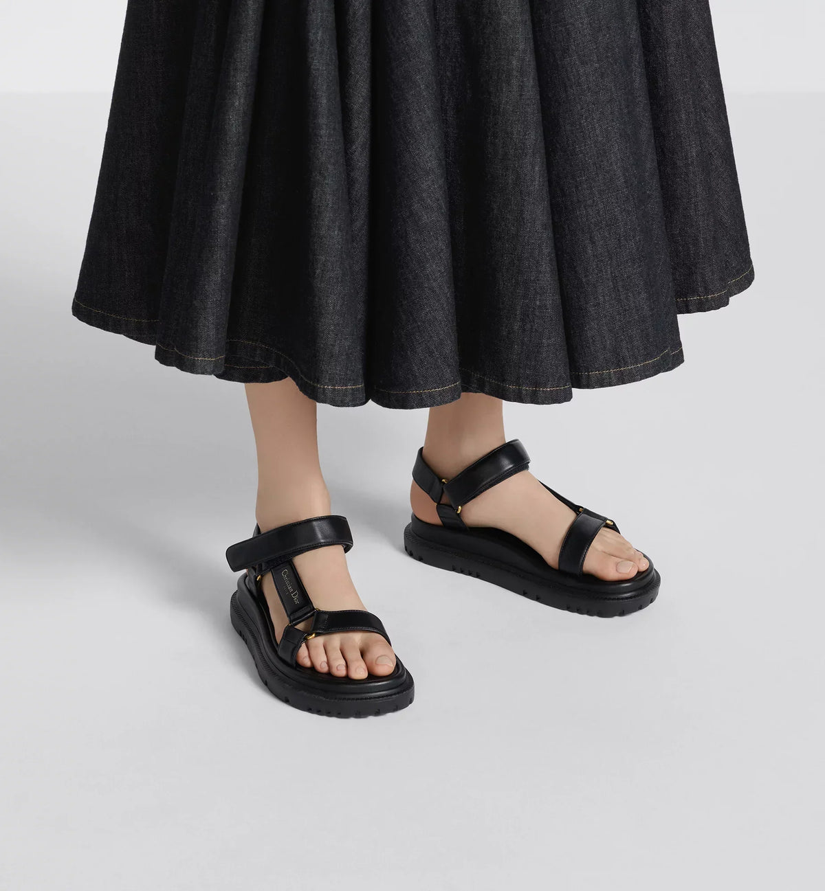 D-Wave Trendy Sandal – the style has black lambskin straps enhanced by the gold-tone Christian Paris – LUX VERSE Luxury Designer Fashion Outlet