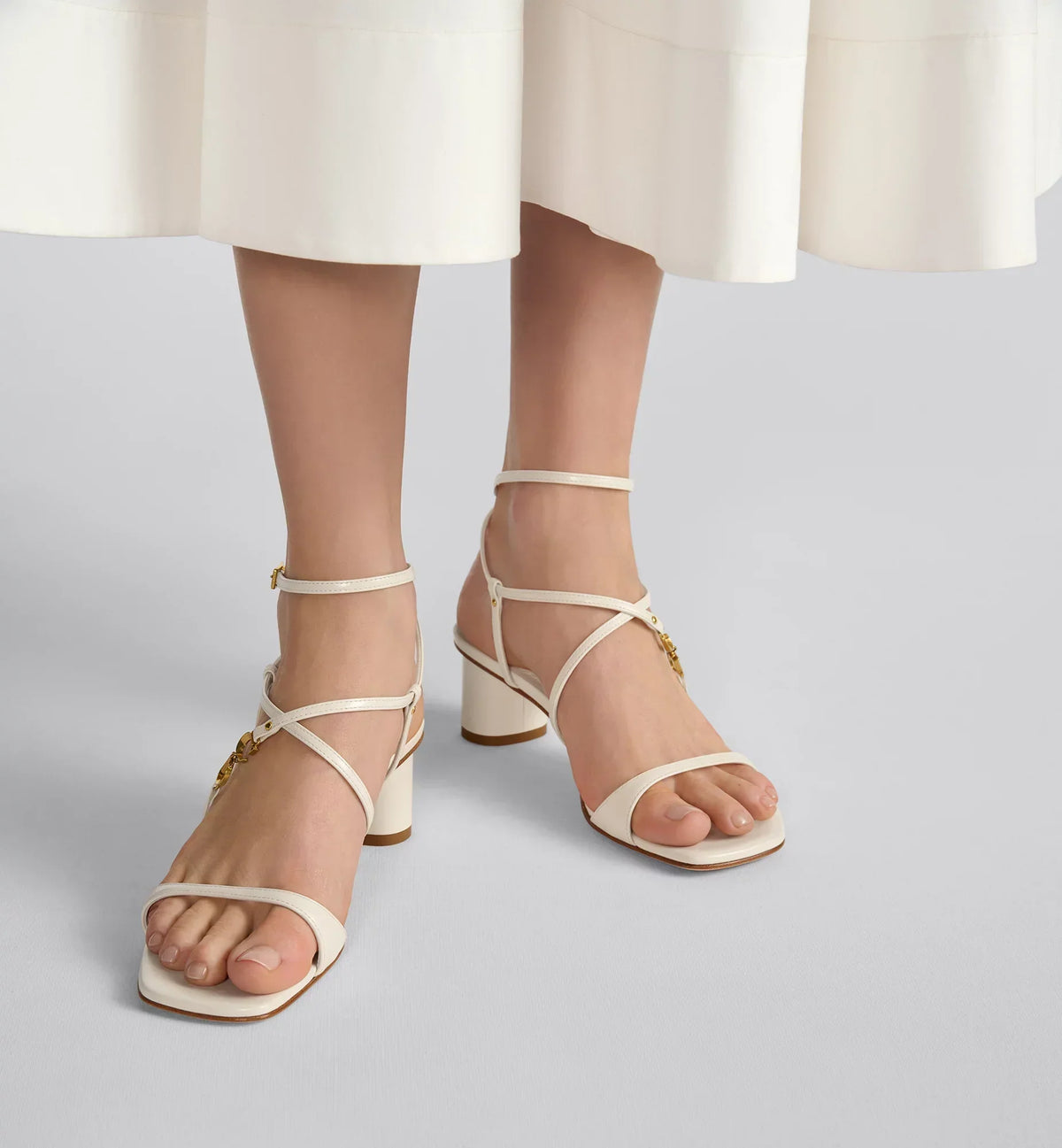 C'est Heeled Sandal – the asymmetric white calfskin upper is complemented by an adjustable buckled strap – LUX VERSE Luxury Designer Fashion Outlet