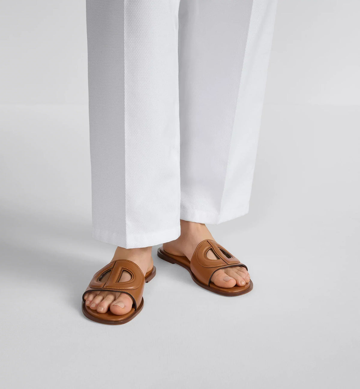 D-Club Slide Padded calfskin – the camel calfskin upper with contrasting dyed edges is embellished with an openwork – LUX VERSE Luxury Designer Fashion Outlet