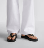 Thong Trendy Sandal – its platform silhouette is crafted in black leather-effect fabric, while the strap – LUX VERSE Luxury Designer Fashion Outlet