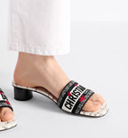 Dway Heeled Slide Adore Motif – the white upper is embroidered with the black Christian Paris signature and is – LUX VERSE Luxury Designer Fashion Outlet