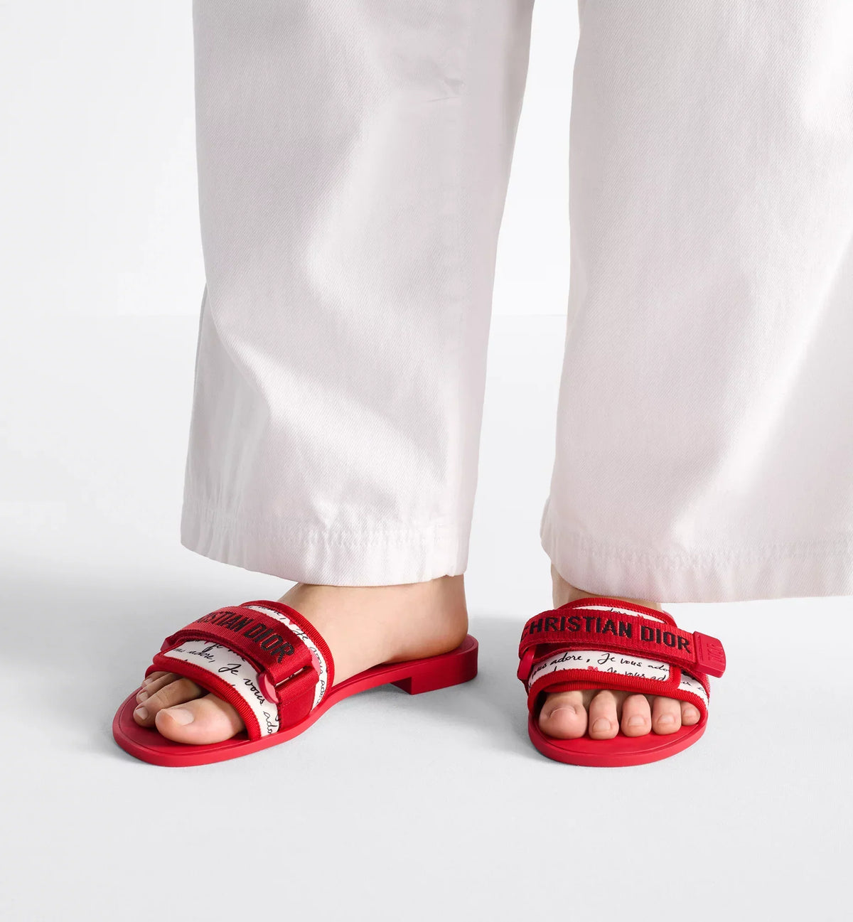 Evolution Slide – the Christian signature self-fastening strap adorns the white technical fabric – LUX VERSE Luxury Designer Fashion Outlet