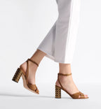 Icon Heeled Sandal – the camel calfskin crisscrossing straps are complemented by the 8-cm (3) Graphic – LUX VERSE Luxury Designer Fashion Outlet