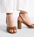 Icon Heeled Sandal – the camel calfskin crisscrossing straps are complemented by the 8-cm (3) Graphic – LUX VERSE Luxury Designer Fashion Outlet