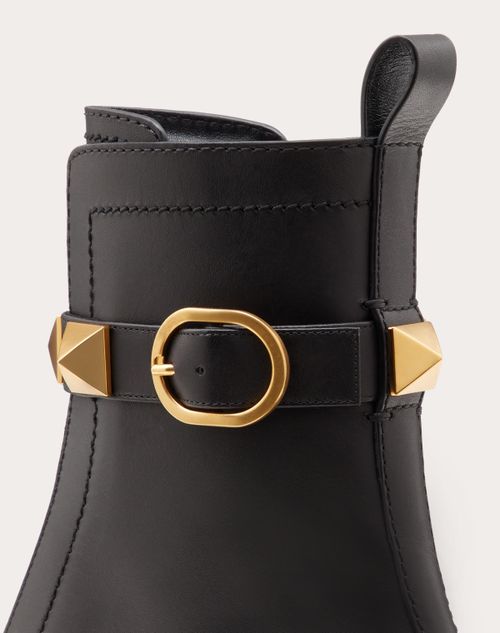 Roman Stud Calfskin Combat Boot 40mm – relief design- Side zipper fastening and strap with maxi buckle- Heel – LUX VERSE Luxury Designer Fashion Outlet