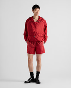 Re-Nylon swim trunks – the style with a classic silhouette, characterized by the elasticized waistband, is – LUX VERSE Luxury Designer Fashion Outlet