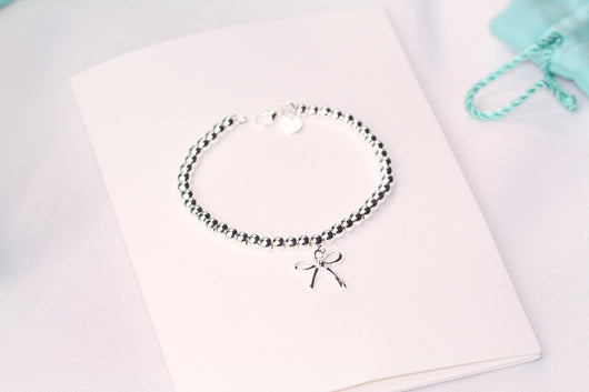 STERLING SILVER BOW BEAD BRACELET - LUX VERSE - Luxury designer fashion outlet