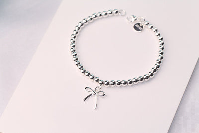 STERLING SILVER BOW BEAD BRACELET - LUX VERSE - Luxury designer fashion outlet
