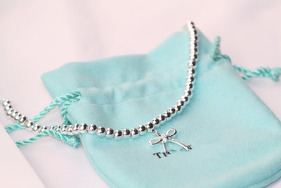STERLING SILVER BOW BEAD BRACELET - LUX VERSE - Luxury designer fashion outlet