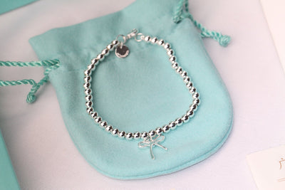 STERLING SILVER BOW BEAD BRACELET - LUX VERSE - Luxury designer fashion outlet