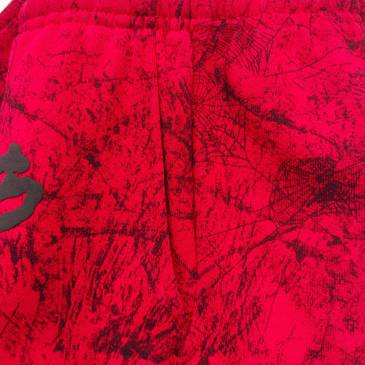 Rote Jogginghose mit Spinnenweben-Print – Herren