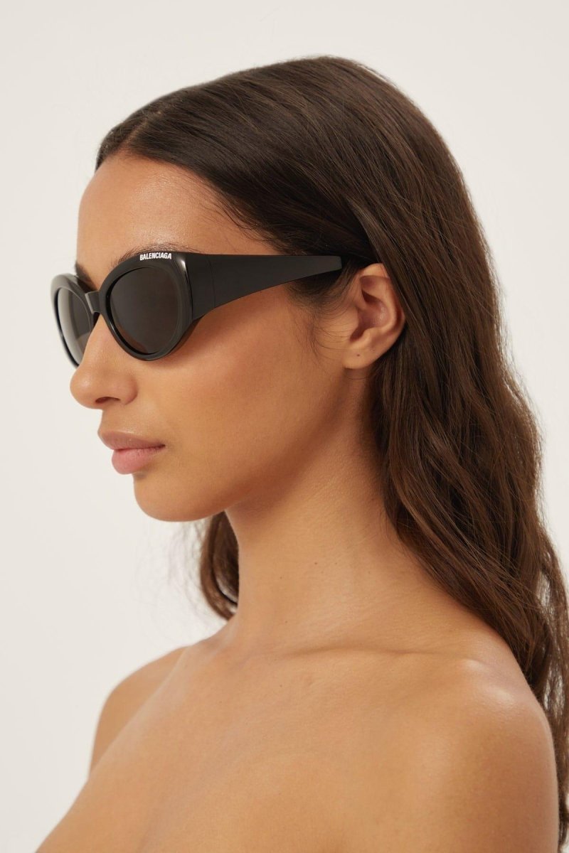 Black oval sunglasses – a concept featuring really smooth surfaces, volumes and peculiar bended end pieces – LUX VERSE Luxury Designer Fashion Outlet