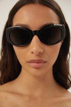 Black oval sunglasses – the lasered logo is enhanced with enamel and is placed on the top bevel reaching – LUX VERSE Luxury Designer Fashion Outlet