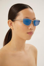Blue metal cat eye sunglasses – lettering logo, enhanced with enamel, is integrated in the structure – LUX VERSE Luxury Designer Fashion Outlet
