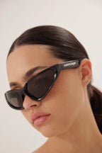 Xpander BB0202s-001 wrap around black sunglasses – high relief metallic logo is prominently stamped on the middle of – LUX VERSE Luxury Designer Fashion Outlet