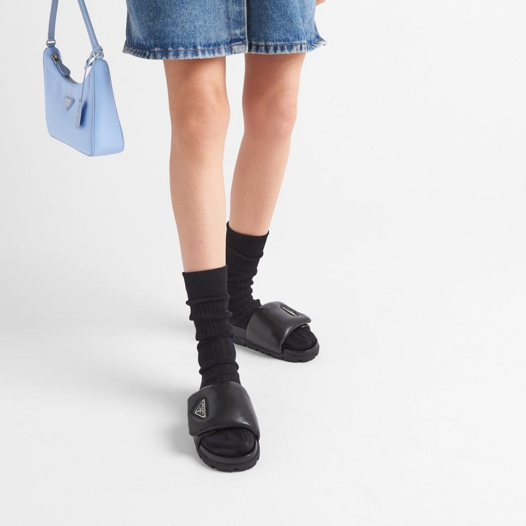 Soft padded nappa leather slides – the triangle logo stands out on the accessory – LUX VERSE Luxury Designer Fashion Outlet