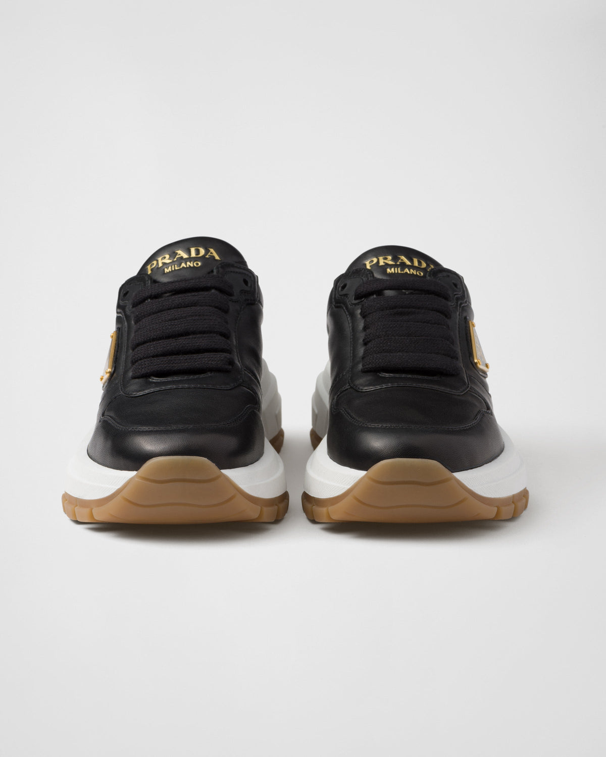 Leather silhouette sneakers – the shoe decorated with different interpretations of the logo is completed by – LUX VERSE Luxury Designer Fashion Outlet