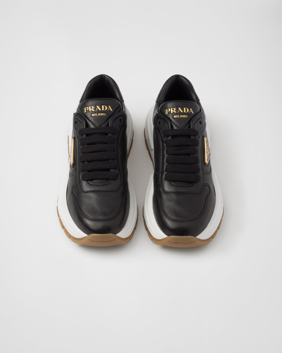 Leather silhouette sneakers – leather lining Enameled metal triangle logo Closure with polyester laces Rubber – LUX VERSE Luxury Designer Fashion Outlet
