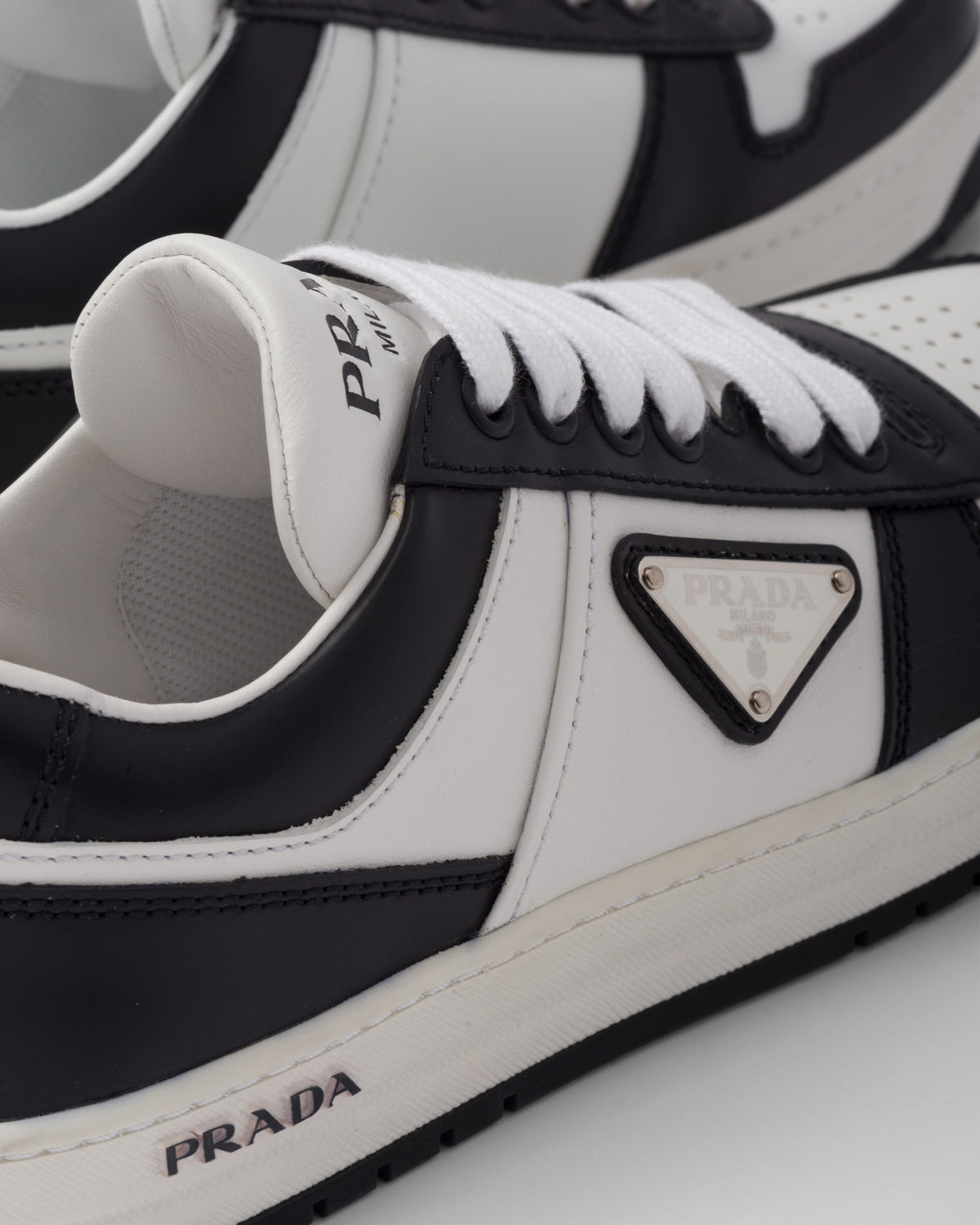 Downtown perforated leather sneakers – perforated motif on the upper Leather lining Enameled metal triangle logo Cotton – LUX VERSE Luxury Designer Fashion Outlet
