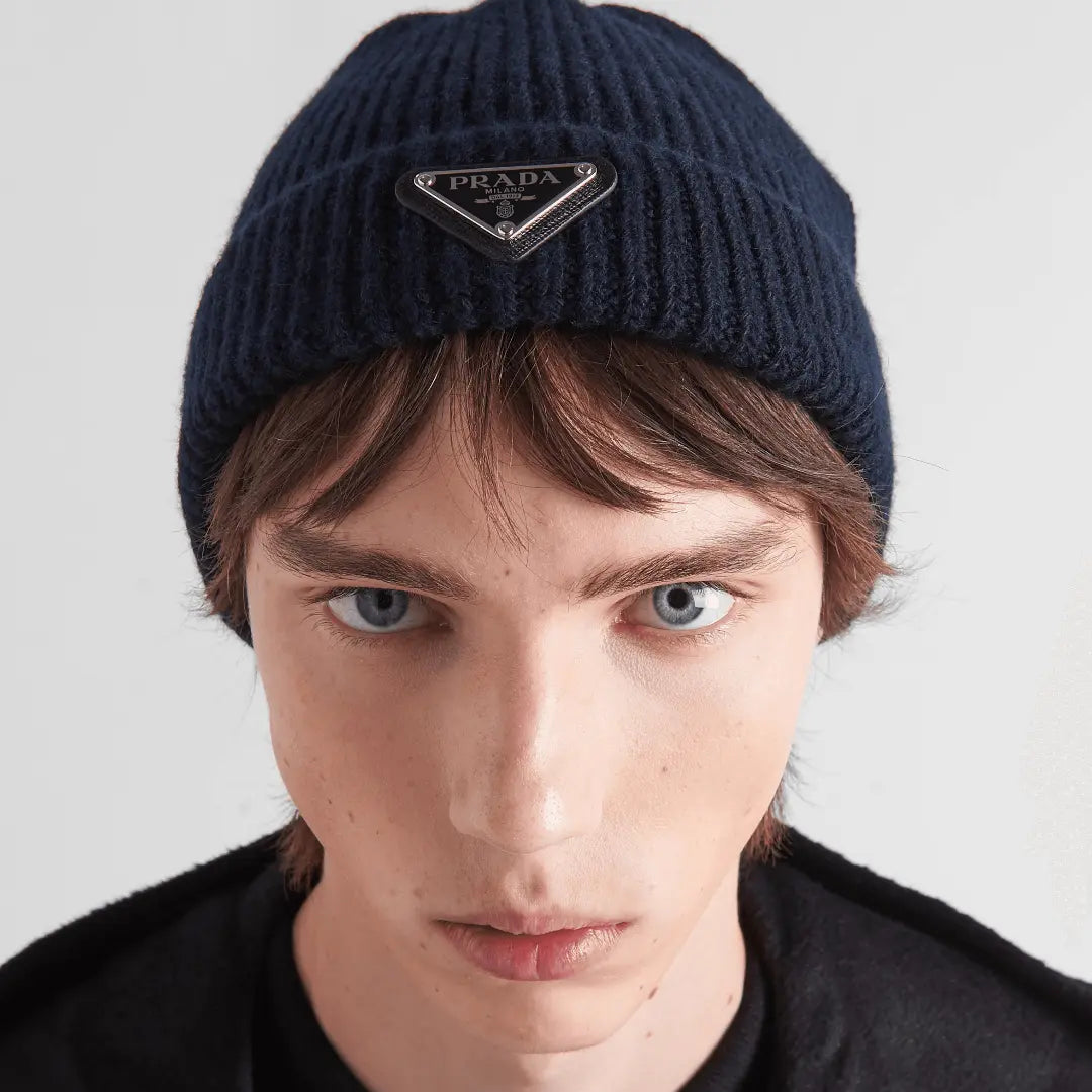 Wool and cashmere beanie – the iconic enameled metal triangle logo stands out on a leather triangle patch – LUX VERSE Luxury Designer Fashion Outlet