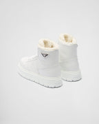 Leather and shearling high-top sneakers – upper with enameled eyelets Shearling lining Enameled metal triangle logo Closure – LUX VERSE Luxury Designer Fashion Outlet
