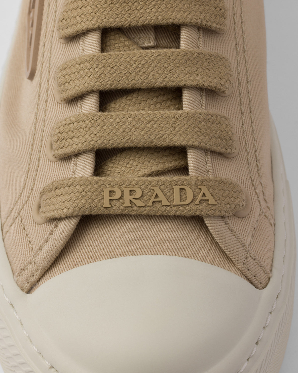 Laced sneakers – upper with rubber toe cap Leather lining--Embossed rubber triangle logo Logo-print – LUX VERSE Luxury Designer Fashion Outlet